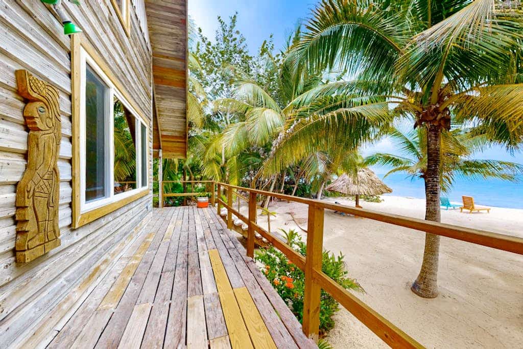 Romantic beachfront home w/ ocean views, dock, hammock, veranda & free WiFi
