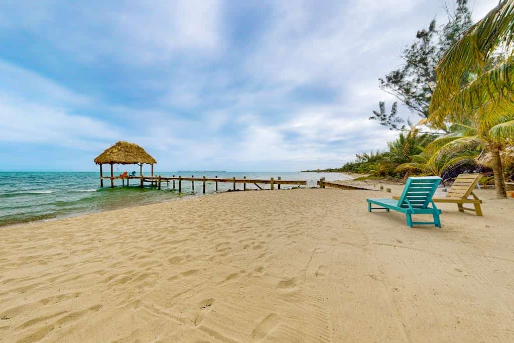 Romantic beachfront home w/ ocean views, dock, hammock, veranda & free WiFi