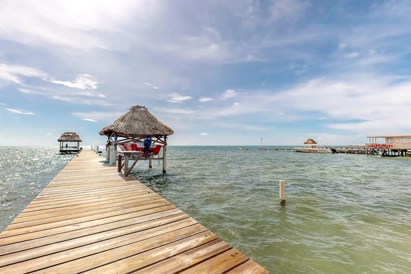 Beachfront condo w/ Caribbean Sea view, shared pool/dock, partial AC & WiFi