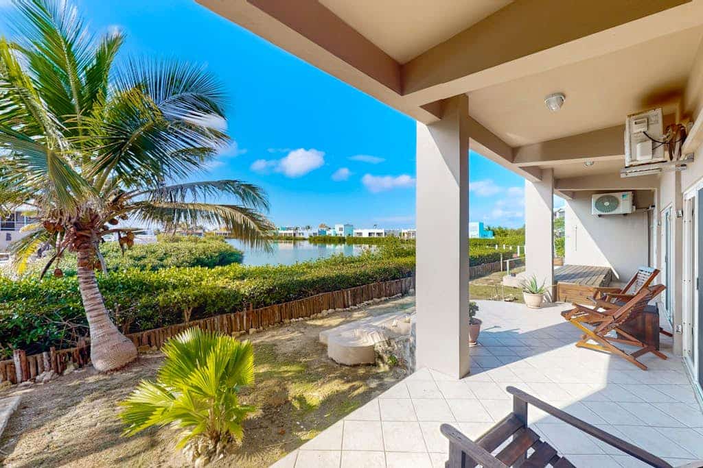 Vibrant, colorful lagoon-front suite with pool access, scenic patio, & W/D