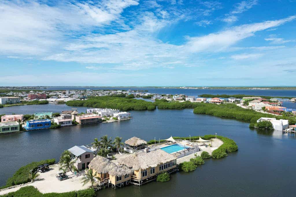 Vibrant, colorful lagoon-front suite with pool access, scenic patio, & W/D