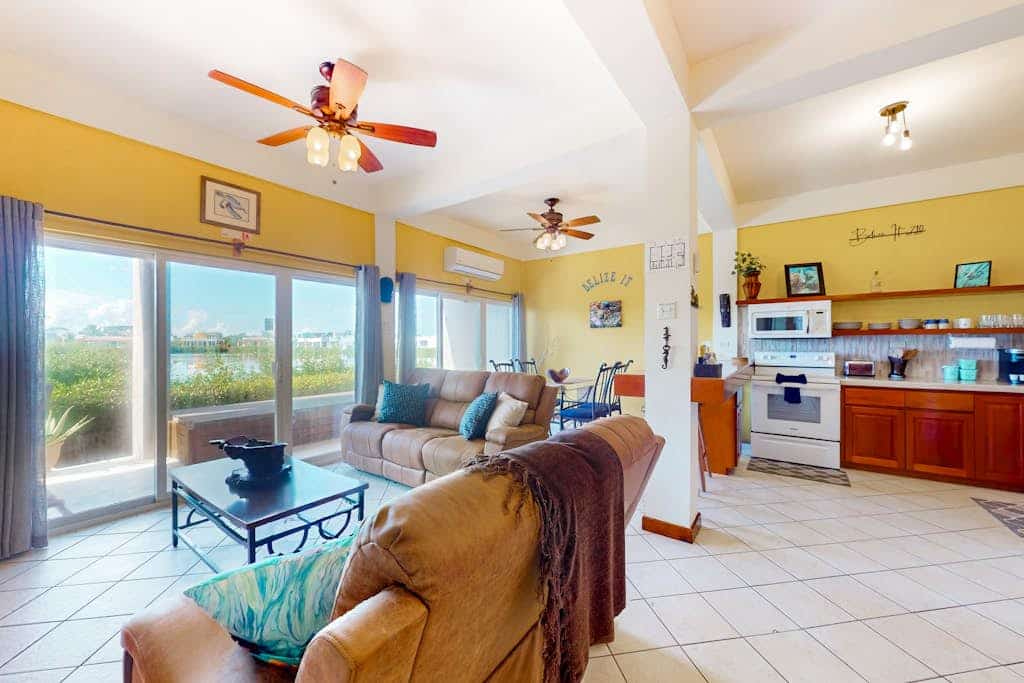 Vibrant, colorful lagoon-front suite with pool access, scenic patio, & W/D