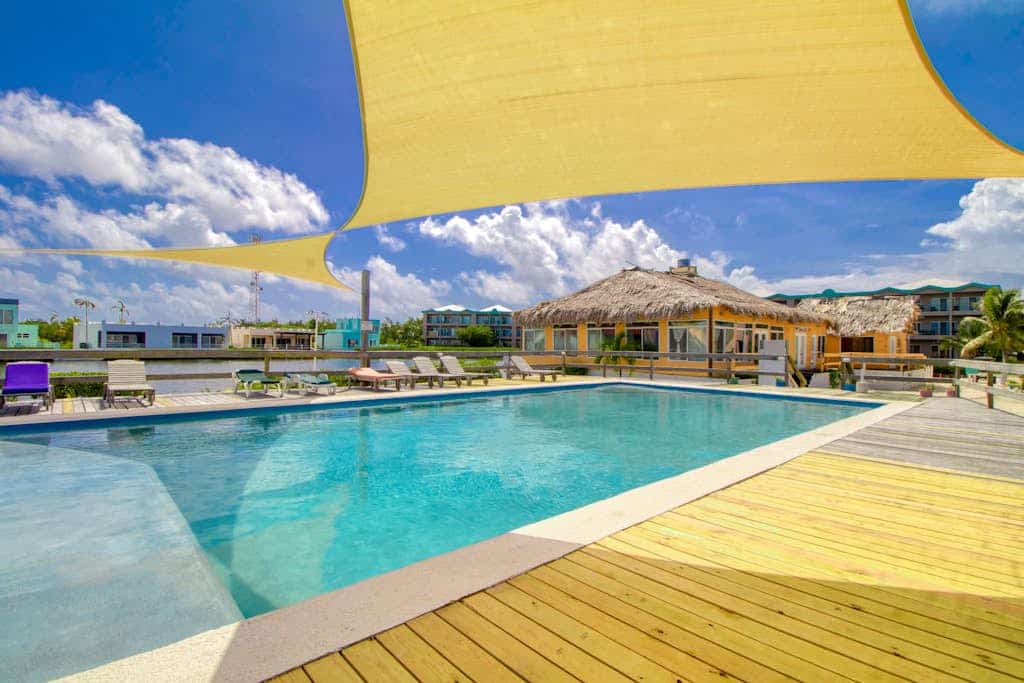 Stylish condo near the beach with pool, fast WiFi, partial ocean views & AC