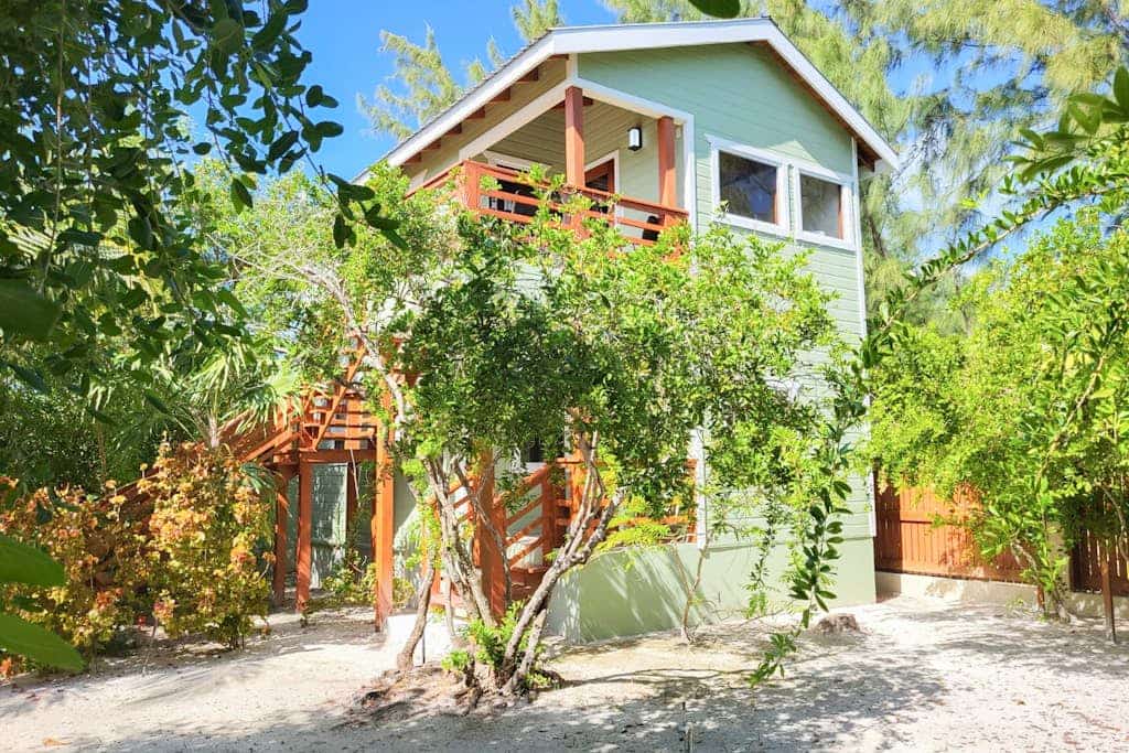Scenic retreat on the beach with a balcony - pool, grill, dock, and canoe access