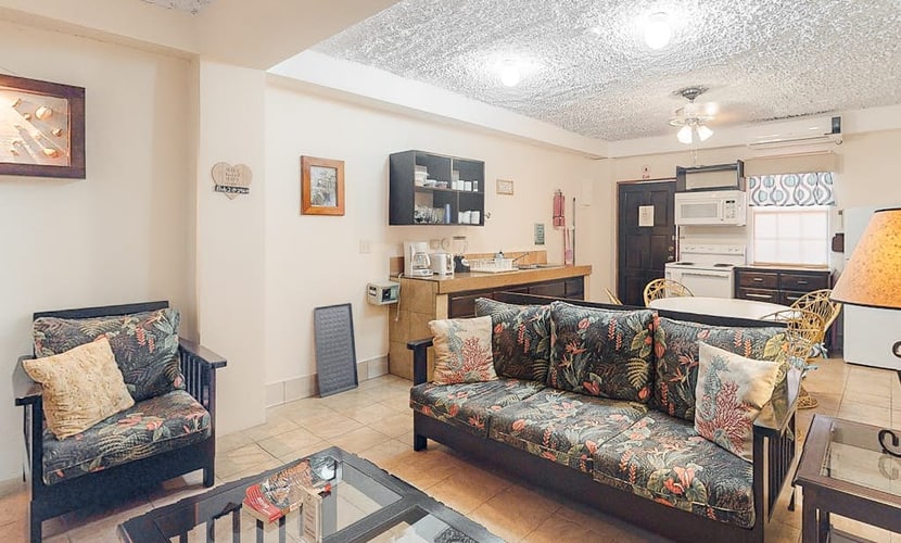 Homey suite in town w/ WiFi, partial AC, shared pool & veranda - walk to beach