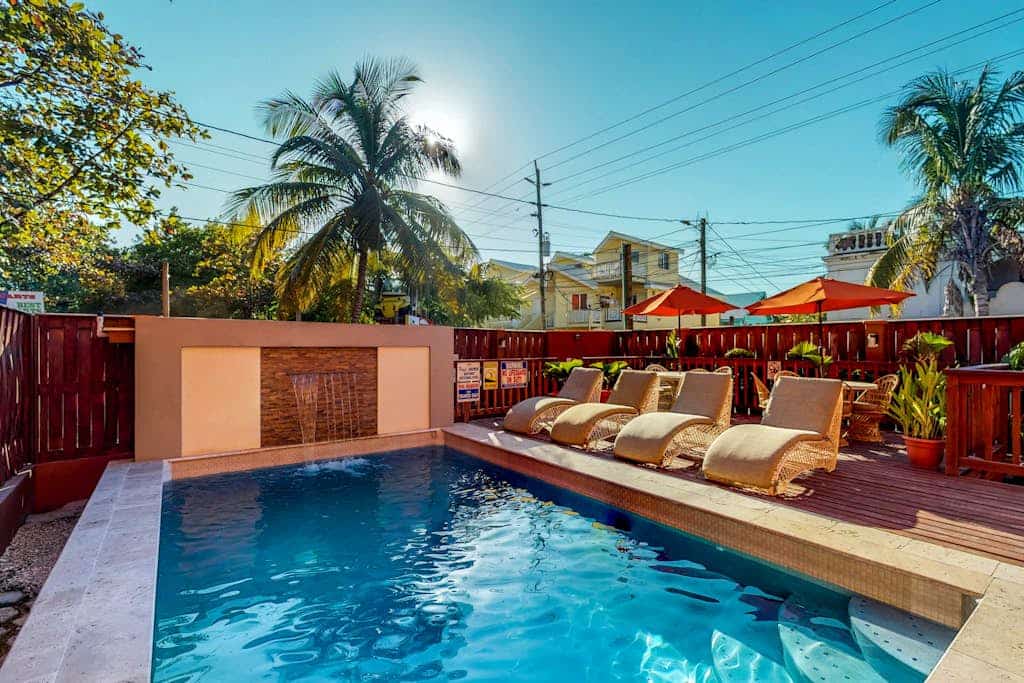 Homey suite in town w/ WiFi, partial AC, shared pool & veranda - walk to beach