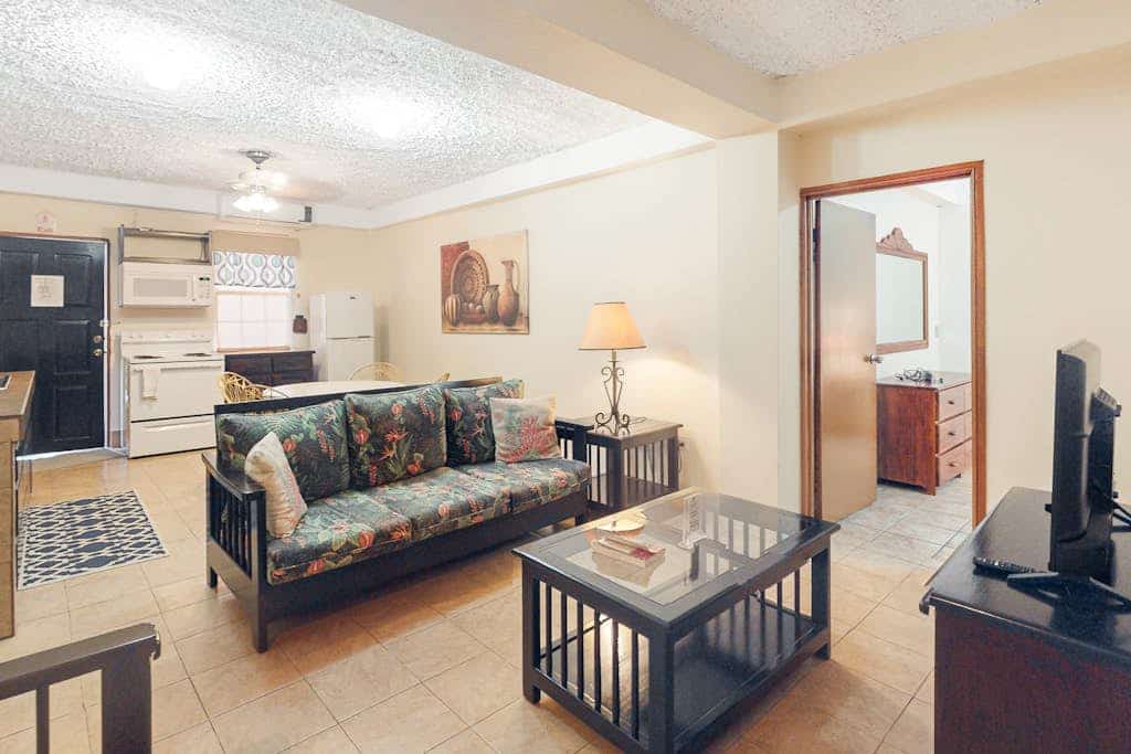 Homey suite in town w/ WiFi, partial AC, shared pool & veranda - walk to beach