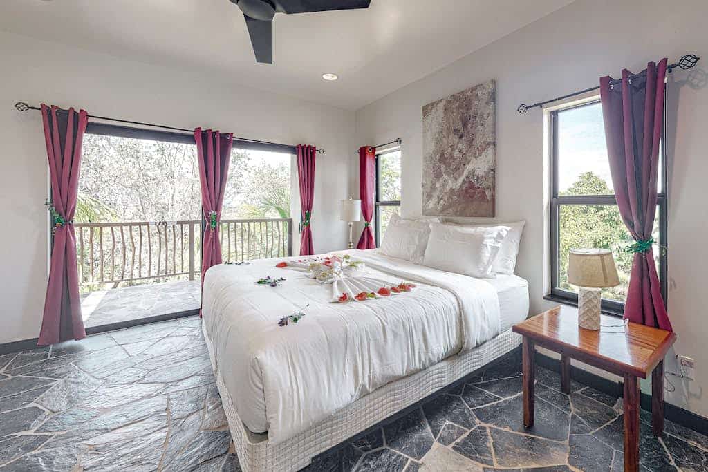 Dog-friendly and off-grid, this spacious three-bedroom home in Red Rock, formerly known as The Reserve / Sanctuary Bay, offers a peaceful natural setting with access to the development’s shared Beach Club and swimming pool. Designed for up to six guests, it pairs open-plan living and covered outdoor spaces with a comfortable base for exploring Stann Creek.