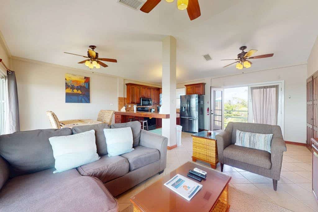 Sunny third-floor waterfront villa with outdoor pool, balcony, & AC