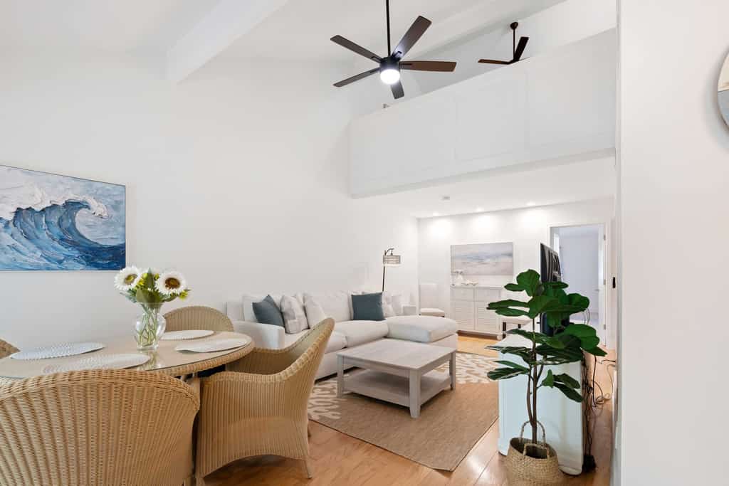 Enjoy a relaxing stay in this welcoming home located within a short walk to all the shops restaurants, Beach, Tennis and Golf! The living space is spacious and comfortable with a separate Carolina room with lots of windows. The dining area and Carolina Room have access to a patio that is just steps to the pool! The townhome has a comfortable king bedroom with a renovated bathroom on the first level for convenience. There are spiral stairs leading to a  loft with 2 twin beds and a walk in shower. This property is perfect for families or small groups seeking both leisure and convenience. Guests will appreciate the quiet setting and location! 