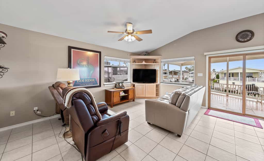 Welcome to Coastal Canal Cottage, a single-level waterfront escape on a quiet canal in Port Isabel's gated Long Island Village. Sip coffee on the covered deck as the breeze rolls in, cast a line from the dock out front, then come inside to a bright open living space with a granite kitchen and water views. With a king primary, a queen guest room, and resort pools, golf, and tennis just across the way, this is easy Gulf Coast living. Book your canal-front getaway.