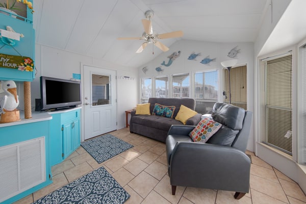 Welcome to Little Breeze, a bright single-level waterfront cottage on a quiet canal in the gated Long Island Village resort near Port Isabel. Sip coffee on the covered deck, take in water views from nearly every window, and settle into a cheerful coastal retreat with a queen bedroom and a living room sleeper sofa. Dive into the resort pools, play the par-3 golf course, or cross the causeway to South Padre Island beaches in minutes. Your easygoing Gulf Coast getaway starts here.