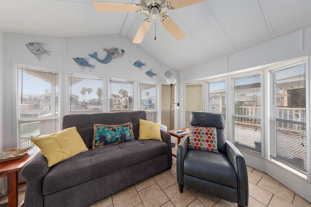 Welcome to Little Breeze, a bright single-level waterfront cottage on a quiet canal in the gated Long Island Village resort near Port Isabel. Sip coffee on the covered deck, take in water views from nearly every window, and settle into a cheerful coastal retreat with a queen bedroom and a living room sleeper sofa. Dive into the resort pools, play the par-3 golf course, or cross the causeway to South Padre Island beaches in minutes. Your easygoing Gulf Coast getaway starts here.