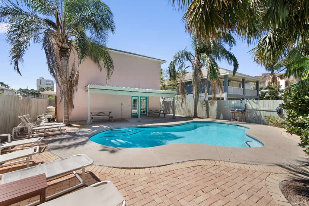 Welcome to Ocean Overlook, a roomy two-story island home made for big groups on South Padre Island. Splash in your private fenced pool, rack 'em up at the downstairs pool table, and spread out across four bedrooms and four baths that sleep up to 16. Cook in two full kitchens, gather in the open upstairs living and dining spaces, and catch the sunset over the bay from the balcony. The beach is just a short hop away.