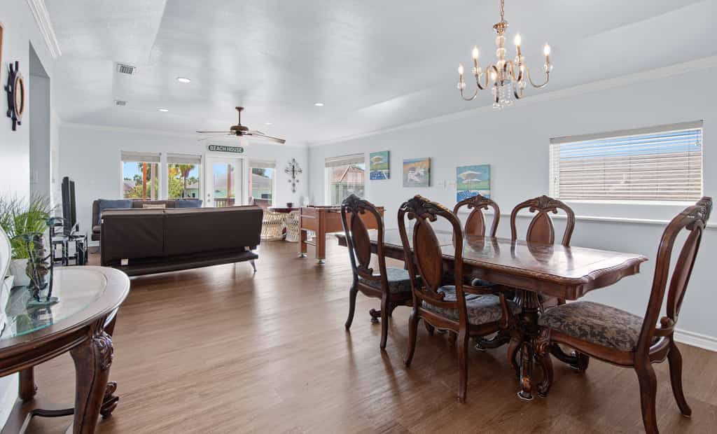 Welcome to 203 Amelia Beach House, a spacious five-bedroom island retreat built for big groups and great times on South Padre Island. Spread out across two living areas and two kitchens, then challenge the crew in the game room with a pool table, ping pong, air hockey, and arcade games. Unwind on the breezy covered decks overlooking the water, with room for up to 16 guests. It is the perfect home base for sun, fishing, and family fun on the Texas Gulf Coast.