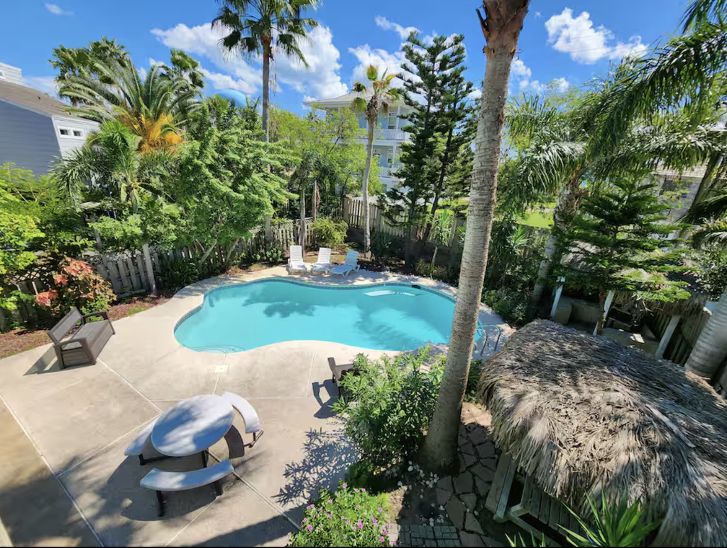 Welcome to Oleander Oasis, a bright two-story island home built for big groups on South Padre Island. Splash in your private pool, relax under the shaded palapa, and gather upstairs in a soaring open living space with a shuffleboard for friendly competition. Five bedrooms and three baths sleep 16, including two king suites and a fun bunk room for the kids. You are a short walk from the Gulf beach and minutes from Isla Blanca Park. Your island home base is ready.