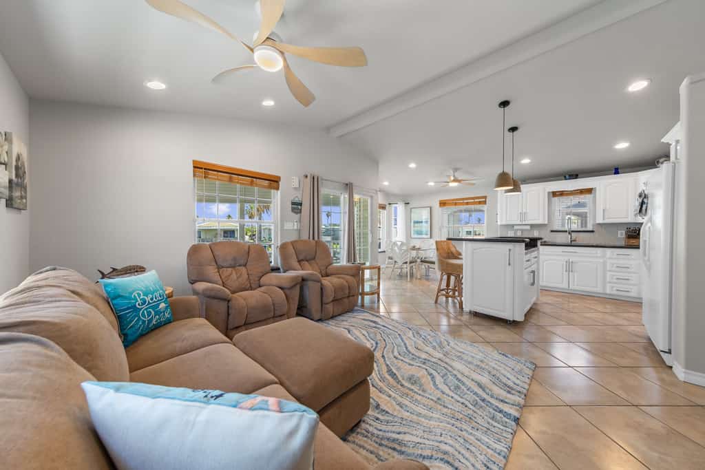 Welcome to 289 Sundial Circle, a single-level waterfront home on the channel in the gated Long Island Village resort near Port Isabel. Sip coffee on the covered deck as the water glides by, then gather in the open living, kitchen, and dining space. A king primary suite and a queen guest room rest your group in comfort. Dive into the resort pools, play the 18-hole golf course, or cross the causeway to South Padre Island beaches in minutes. Your easygoing Gulf Coast escape starts here.