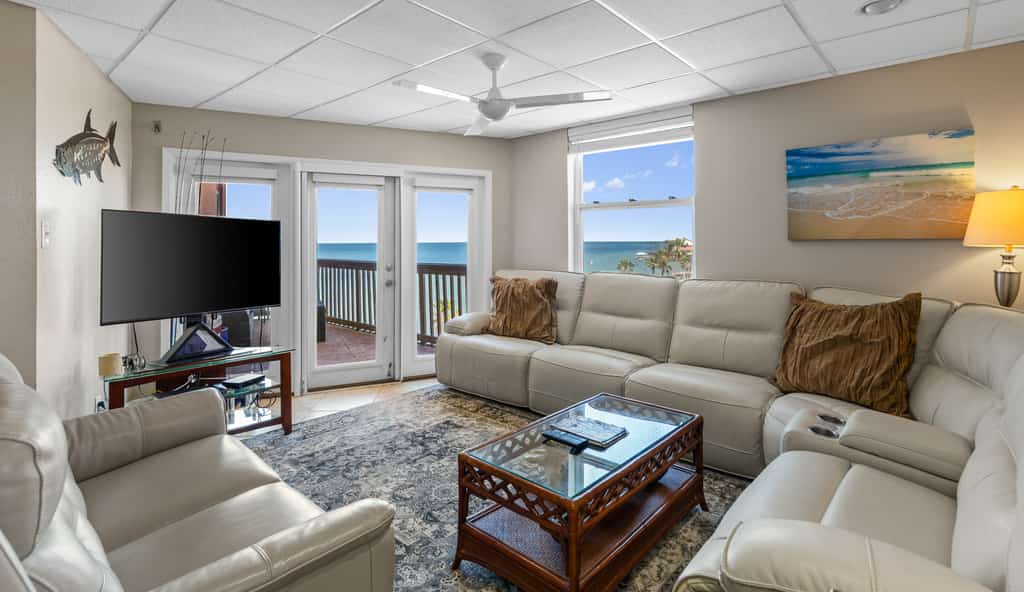 Welcome to Galleon's Getaway, a breezy bayfront condo on South Padre Island. Watch calm Laguna Madre water from your wraparound balcony, sip morning coffee in the salt air, and fire up the grill as the sun drops over the bay. Inside, an open living space, full kitchen, and two bedrooms sleep four. The shared pool and hot tub sit steps away, and the Gulf beaches are a short trip across the island. Made for longer stays, it is an easy place to settle in for a month or a season on the water.