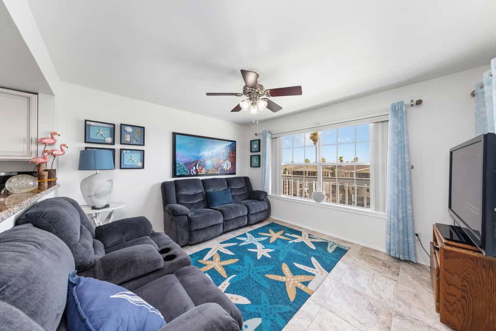 Welcome to Lazy Days Sea Cottage, a two-story canal-front retreat in Port Isabel's gated Long Island Village. Take in the water from the upstairs deck, watch the boats drift along the canal, and gather in a bright, beachy living space with a full kitchen. A king primary suite tops the home, and a family bunk room sleeps the kids, with room for six in all. Resort pools, golf, and tennis are steps away, and South Padre Island beaches are a ten-minute drive over the causeway.