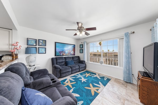 Welcome to Lazy Days Sea Cottage, a two-story canal-front retreat in Port Isabel's gated Long Island Village. Take in the water from the upstairs deck, watch the boats drift along the canal, and gather in a bright, beachy living space with a full kitchen. A king primary suite tops the home, and a family bunk room sleeps the kids, with room for six in all. Resort pools, golf, and tennis are steps away, and South Padre Island beaches are a ten-minute drive over the causeway.