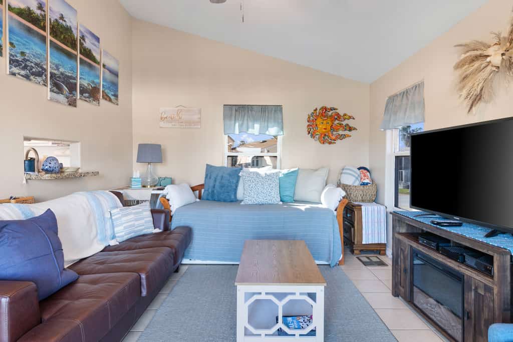 Welcome to Mermaid Manor, a charming waterfront cottage on a quiet canal in the gated Long Island Village resort near Port Isabel. Relax on the covered deck over the water, gather in a bright open living space, and spread out with sleeping for six in a cozy one-bedroom layout. Dive into the resort pools, play the par-3 golf course, or cross the causeway to South Padre Island beaches in minutes. Your easygoing Gulf Coast getaway starts here.