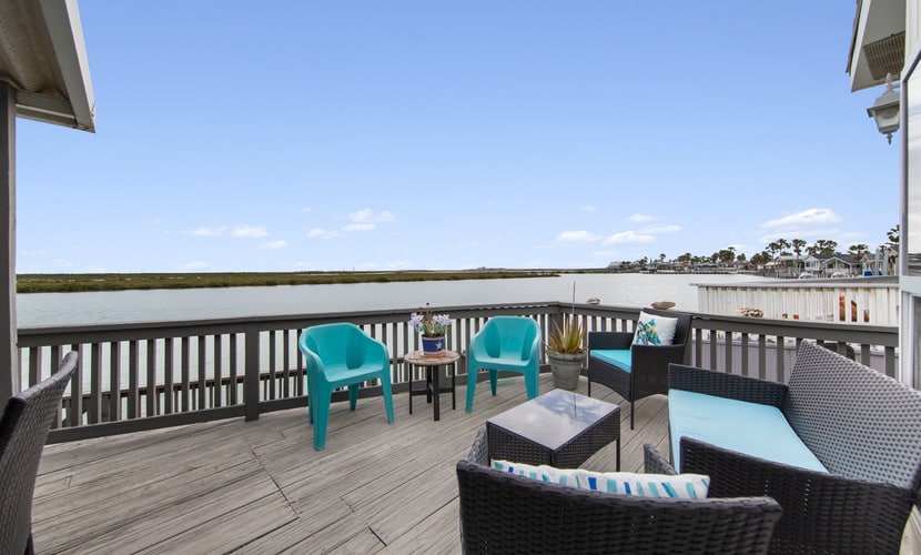 Welcome to Little Launch, a bright waterfront cottage tucked into the gated Long Island Village resort near Port Isabel. Watch the water from your covered deck, catch SpaceX launches lighting up the sky across the bay, and cook easy meals in the full kitchen before heading to the resort pools, golf, and tennis. A queen bedroom and living-room sofa bed sleep four, and South Padre Island beaches are a short drive over the causeway. Coastal calm with a front-row view of the future.
