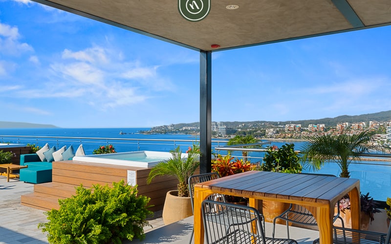 1BR Bucerías condo with pool, gym, balcony, WiFi, and beach views.