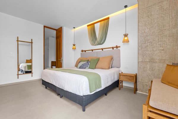 1BR Bucerías condo with pool, gym, balcony, WiFi, and beach views.