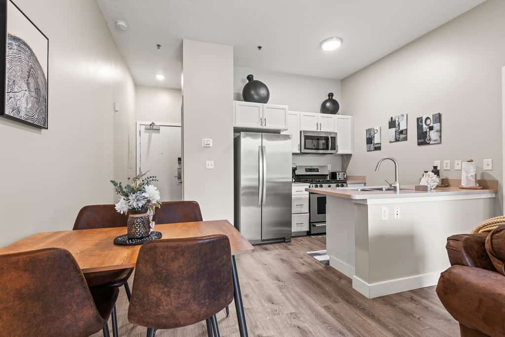 Escape to the perfect mountain getaway in this beautifully furnished 1-bedroom, 2-bathroom condo in Heber City. Thoughtfully designed for comfort and convenience, this rare floor plan offers the privacy of two full bathrooms, making it ideal for couples, small families, business travelers, or friends exploring Utah's Wasatch Mountains.

Relax in the bright, open living area after a day of adventure, prepare meals in the fully equipped kitchen, and unwind in the spacious bedroom featuring plush bedding and ample storage. Whether you're here for a weekend escape or an extended stay, you'll have everything you need to feel right at home.

Located just minutes from Jordanelle Reservoir, Deer Valley East Village, and Park City, you'll enjoy easy access to world-class skiing, hiking, mountain biking, boating, golf, and year-round outdoor recreation. Historic Main Street Park City, local restaurants, shopping, and the charm of downtown Heber are all just a short drive away.

Highlights
Rare 1 bedroom, 2 full bathroom layout
Cozy fireplace for relaxing evenings
Fully equipped kitchen
Comfortable open-concept living area
On-Site Pool & Fitness Center
High-speed Wi-Fi
Minutes from Deer Valley, Park City and Jordanelle Reservoir
Perfect for vacations, remote work, or extended stays

Whether you're chasing powder in the winter, lake days in the summer, or colorful mountain scenery in the fall, this inviting condo is the perfect home base for making unforgettable memories in every season.