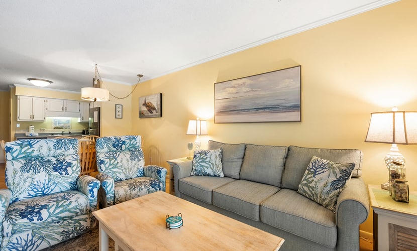 Enjoy a relaxing Hilton Head Island getaway in this comfortable two-bedroom villa at Hilton Head Island Beach and Tennis Resort. Located on the first floor of Building B, this villa features a private furnished balcony with lagoon views, a full kitchen, two full bathrooms, and accommodations for up to six guests. Spend your days at the beach, lounging by the oceanfront pool, or enjoying the resort's tennis courts, pickleball, dining, and family-friendly amenities.