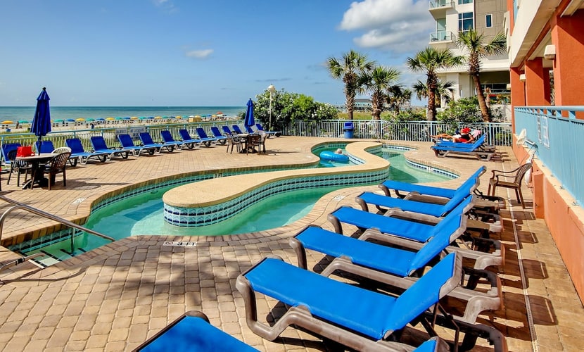 Oceanfront condo with balcony, W/D, pools, & lazy river - walk everywhere