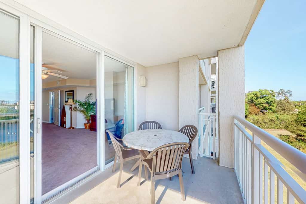 Inviting waterfront condo with pool, hot tub, golf, balcony, & W/D