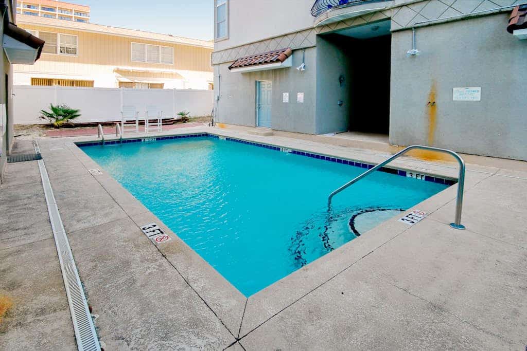 Spacious three-story coastal villa with resort amenities, balconies & jetted tub
