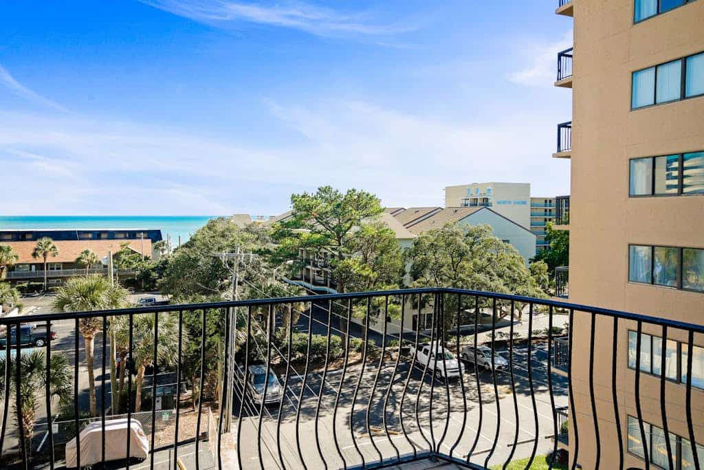 Spacious three-story coastal villa with resort amenities, balconies & jetted tub
