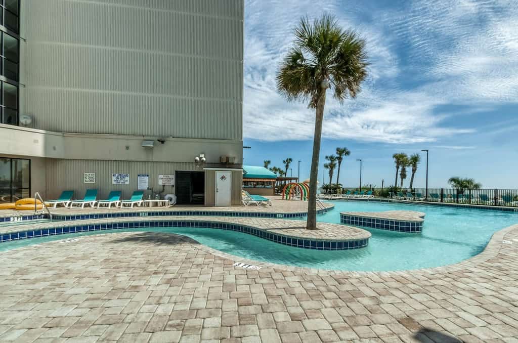 Beachfront resort with indoor/outdoor pools, lazy river, hot tub, gym