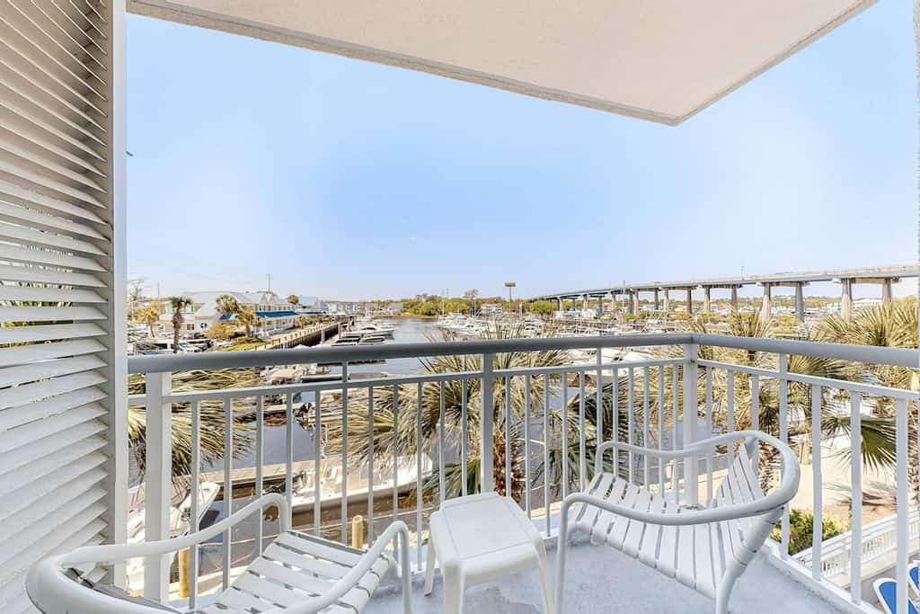 1st floor condo with pool, hot tub, marina view, private W/D & central AC