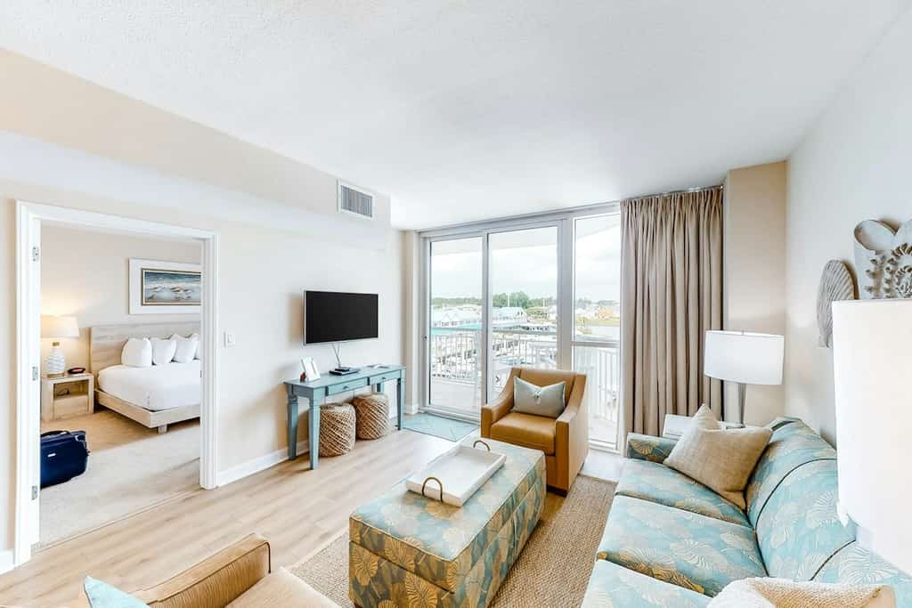 Third-floor condo with pool, hot tub, marina view & private W/D