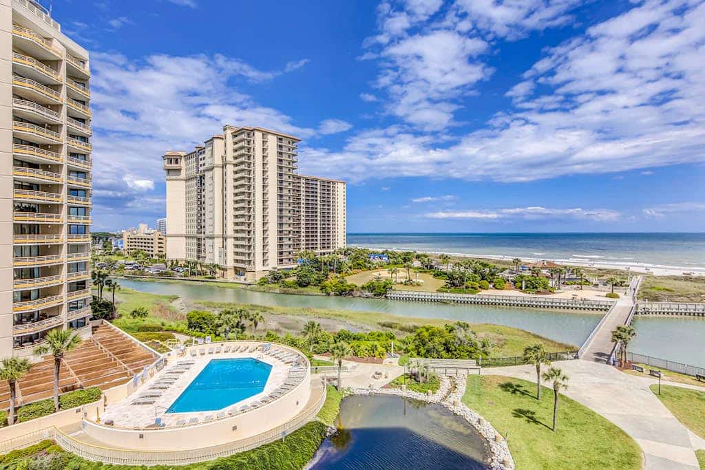 Ocean view condo in oceanfront resort with balcony, pool, hot tub & beach access