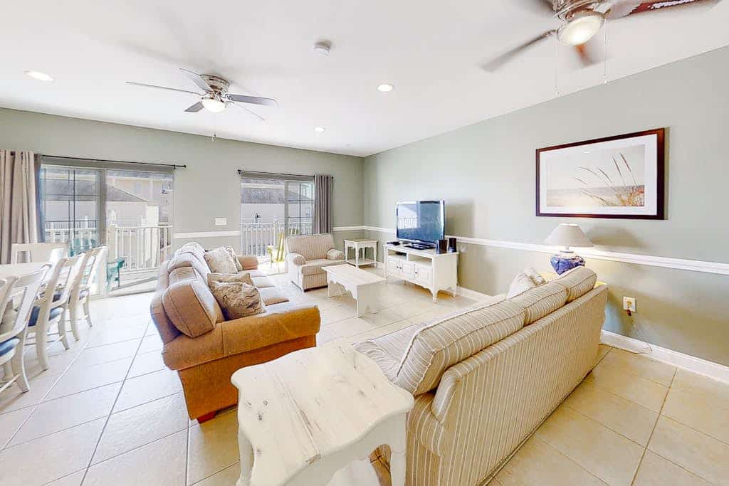 Condo with 2 primary suites, balcony, beach views, grills, & pool-near beach