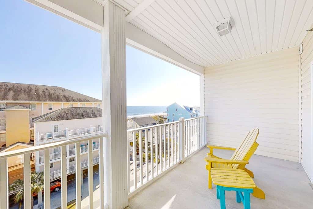 Condo with 2 primary suites, balcony, beach views, grills, & pool-near beach