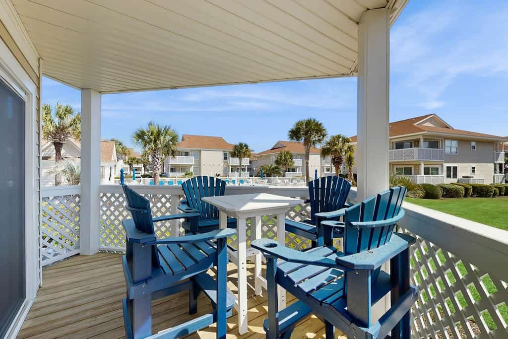Pool view condo with balcony, pool, hot tub & steps to beach