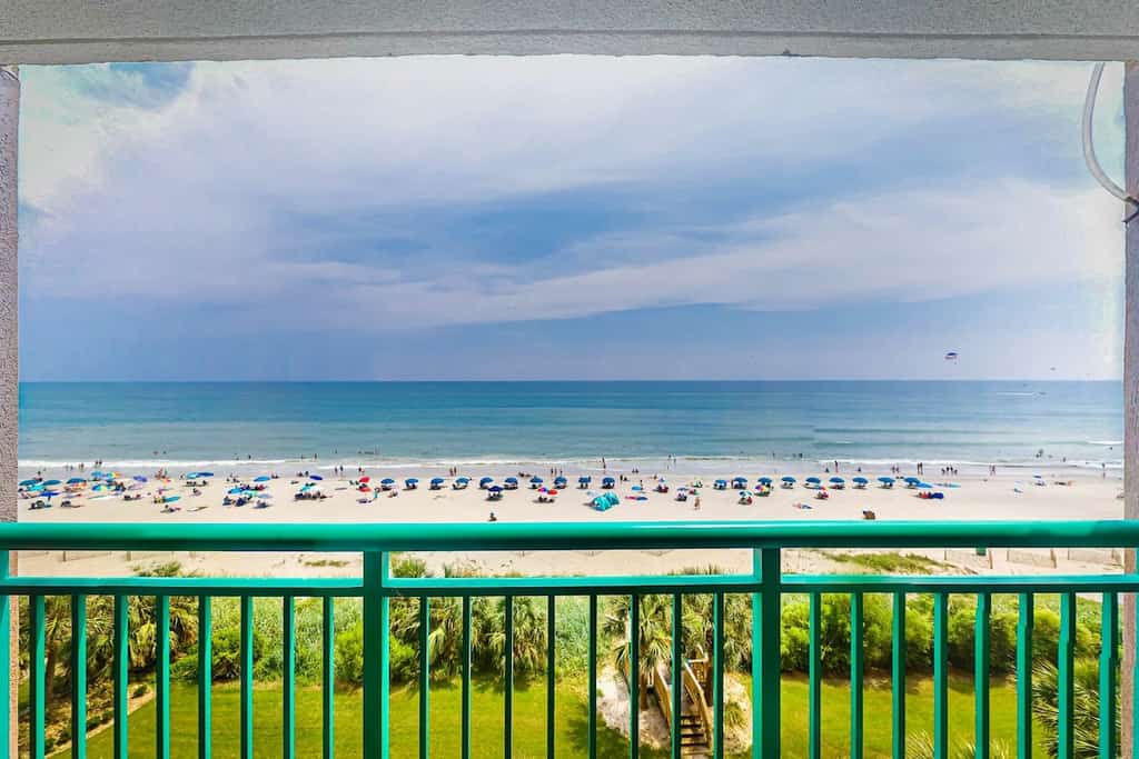 Beachfront condo with ocean-view balcony, A/C, and Smart TVs