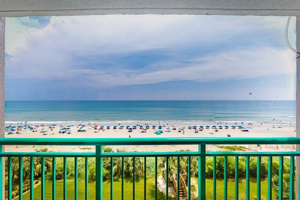Beachfront condo with ocean-view balcony, A/C, and Smart TVs