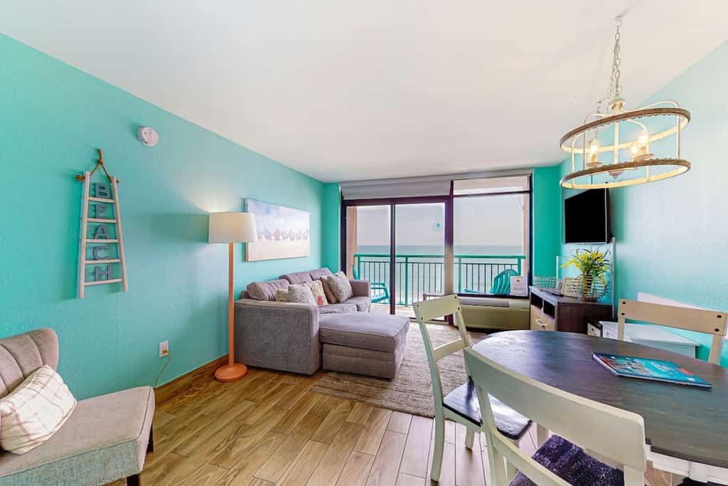 Beachfront condo with ocean-view balcony, A/C, and Smart TVs