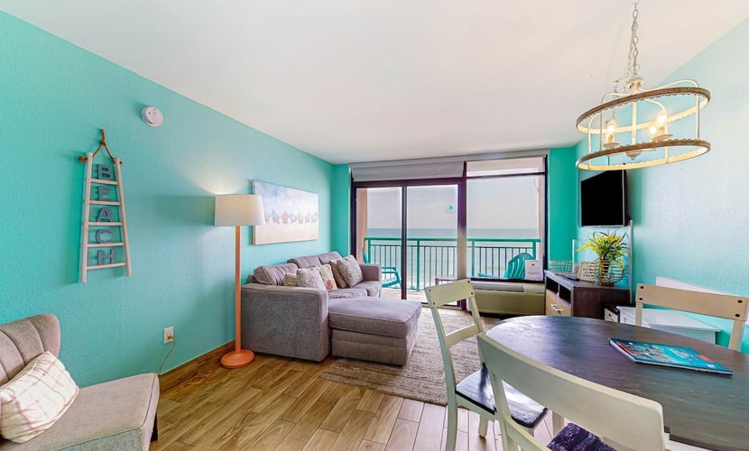 Beachfront condo with ocean-view balcony, A/C, and Smart TVs