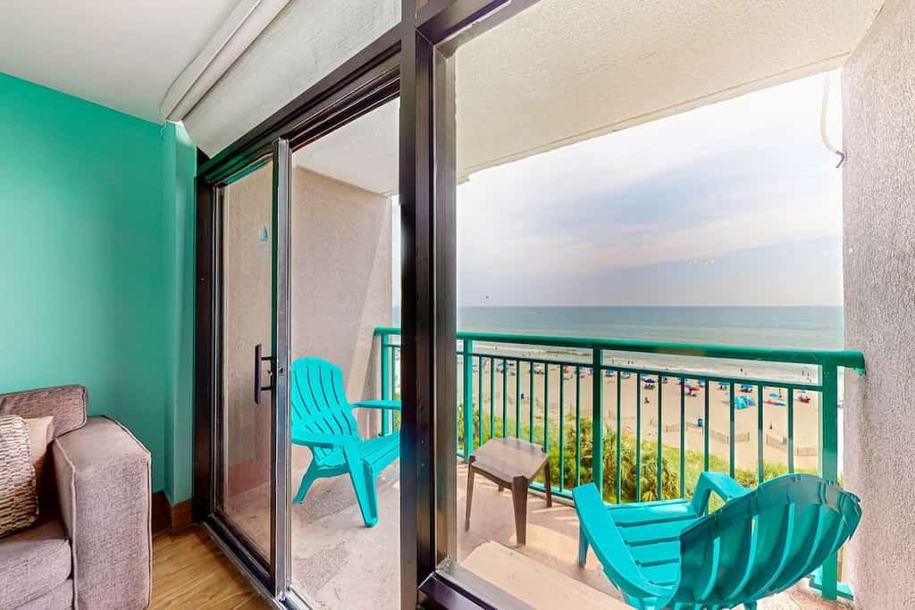 Beachfront condo with ocean-view balcony, A/C, and Smart TVs