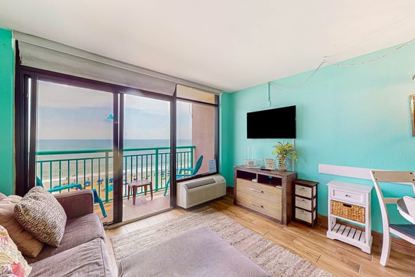 Beachfront condo with ocean-view balcony, A/C, and Smart TVs