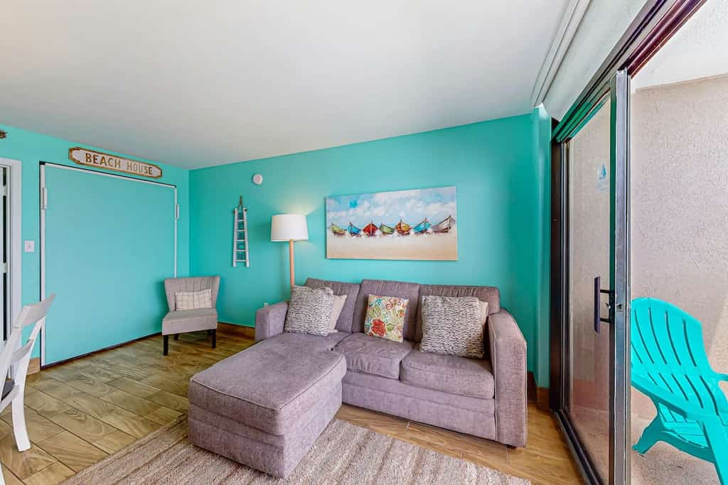 Beachfront condo with ocean-view balcony, A/C, and Smart TVs