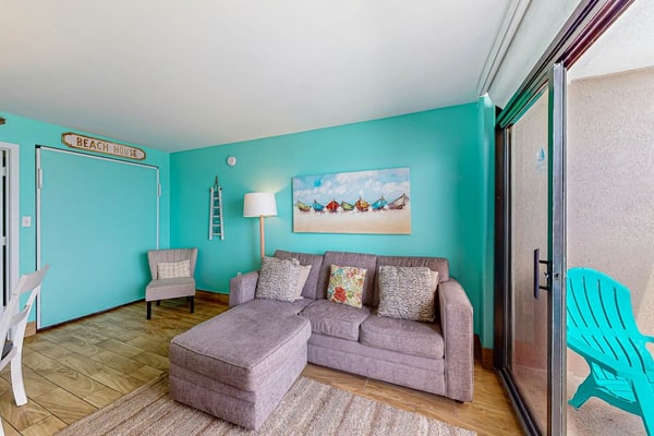 Beachfront condo with ocean-view balcony, A/C, and Smart TVs