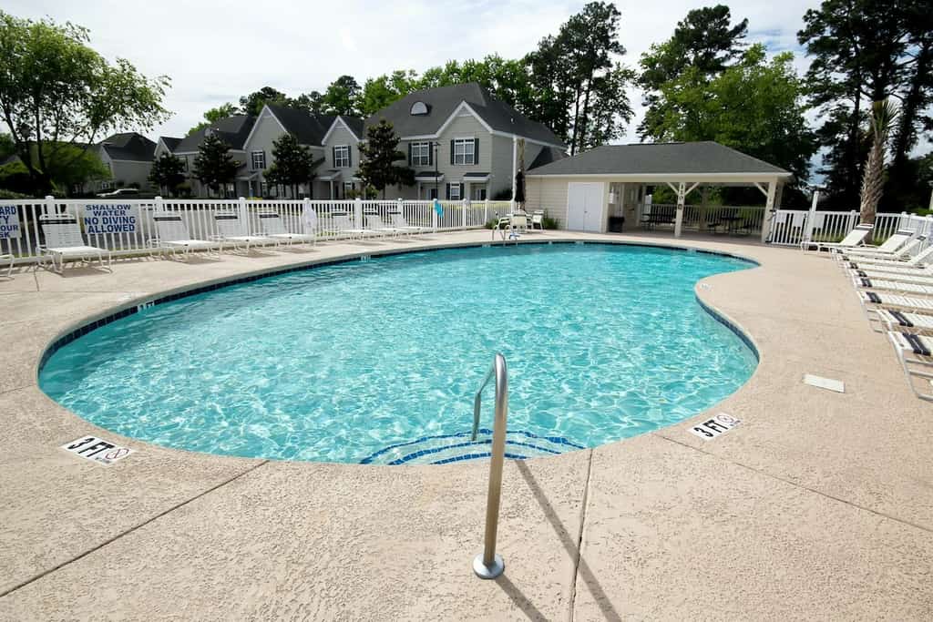 Lake-view ground-floor condo with screened patio, W/D, & pool